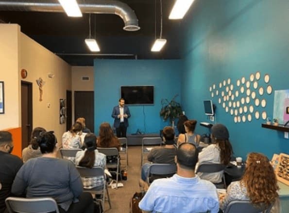 A member presenting to a full room