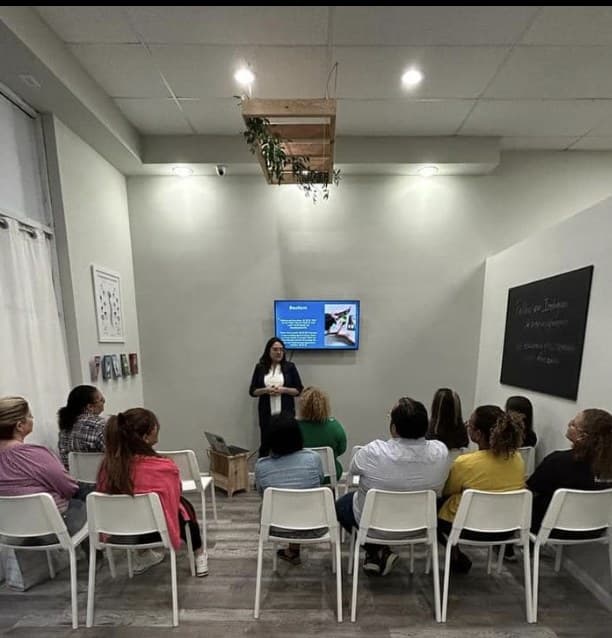 A member presenting to a seated room