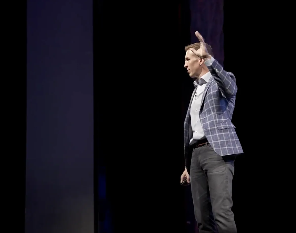 Dr. Steve Tullius speaking on stage